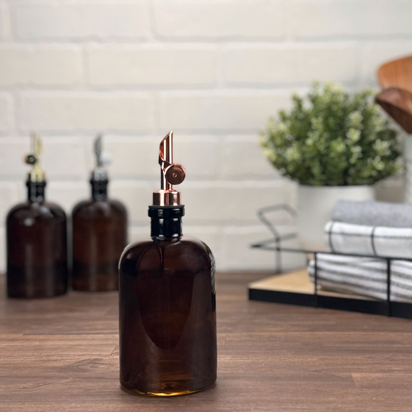 16-ounce Amber Bottle with Weighted Black Nickel Pour Spout